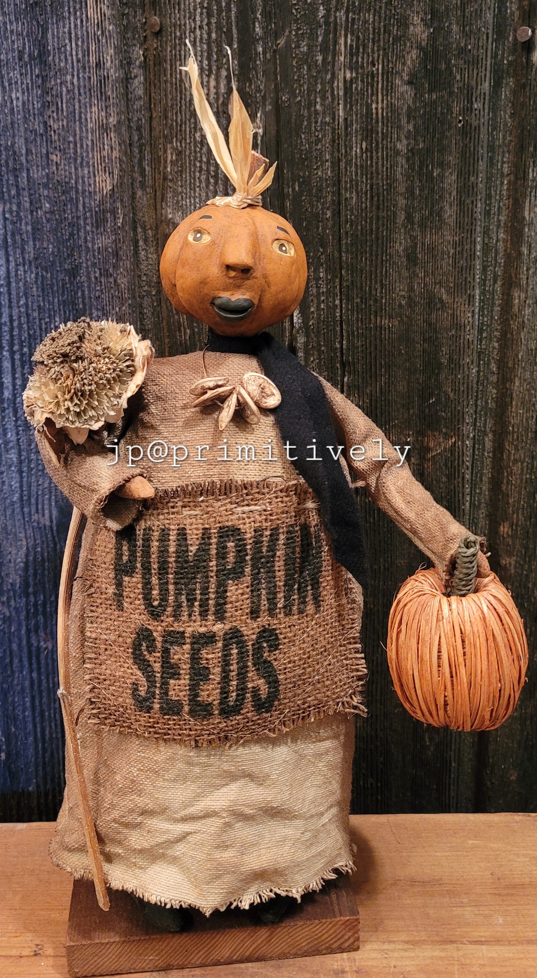 Clay head pumpkin girl with pumpkin and sunflower