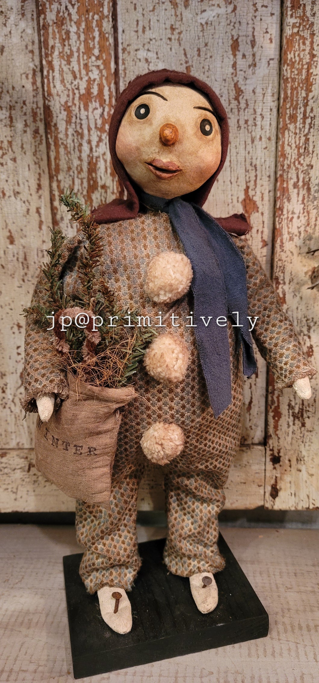 Clay head snow girl with winter bag