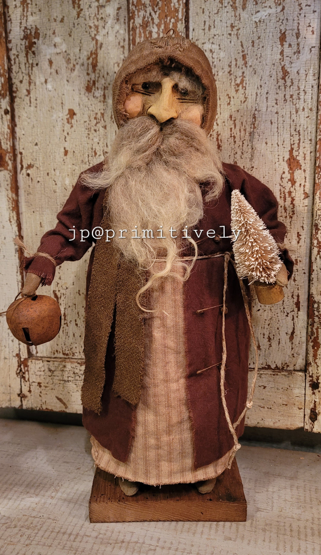 Clay face Santa with bell and tree